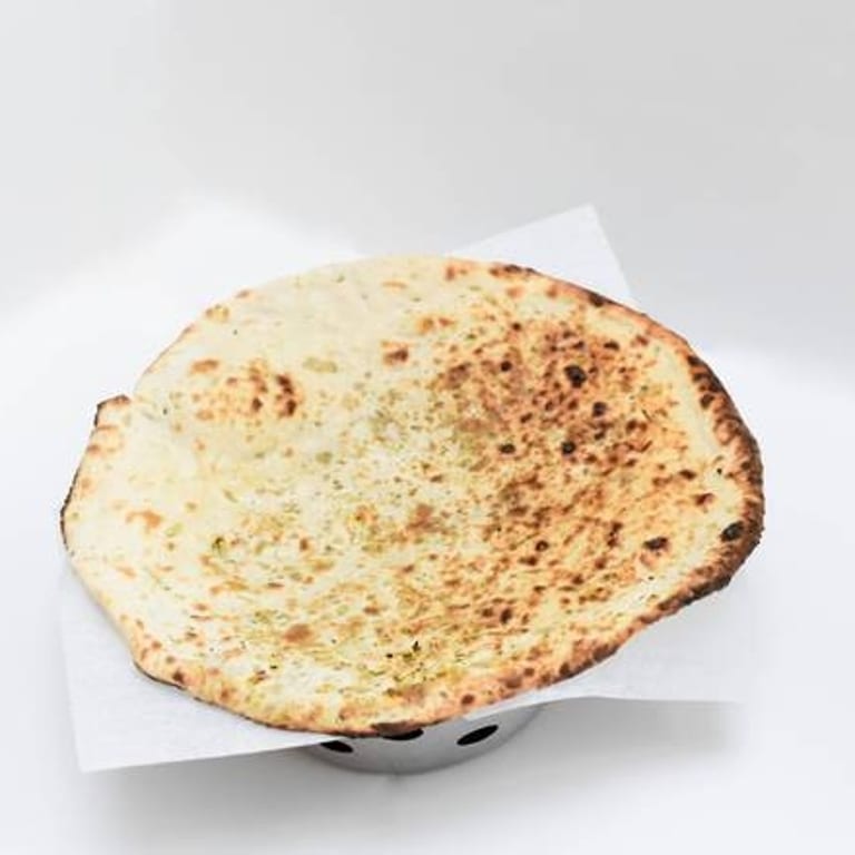 Freshly Baked Naan: A Flavorful Addition