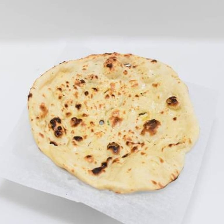 Freshly Baked Naan: A Flavorful Addition